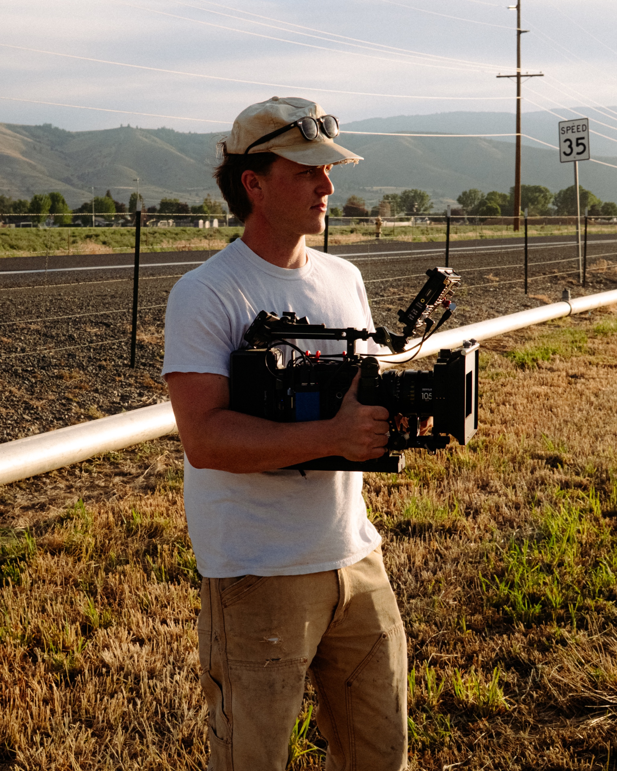 Maxwell Cain holding a cinema camera on location